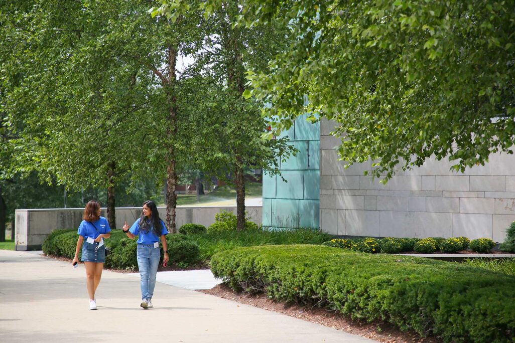 two students walking outside university